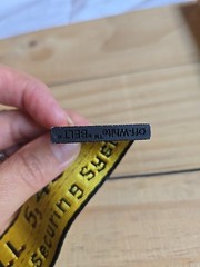 Off-White Industrial Belt in the yellow and black colorway, featuring a black…