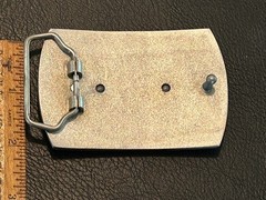 Silver-toned metal belt buckle, embossed crocodile logo and « ITALY »