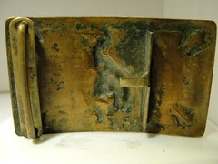 JUSTIN BELT CO. BRASS MATERIAL, IN GOOD CONDITION