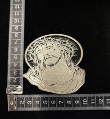 antique silver belt buckle depicts the head of Christ wearing a crown of thorns