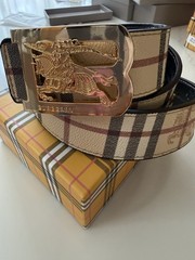 Burberry reversible belt in sand tone. polished metal buckle of the Equestrian