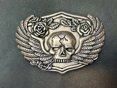 Dimensional Skull Head With Wings And Flowers – Raised Belt Buckle