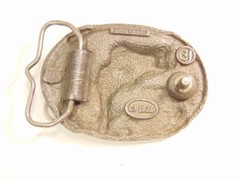 heavy older enameled buckle showing a leaping fish; CJ Inc., 1986, Made in USA