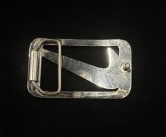 vintage Nike Y2K belt buckle features a polished metal construction RARE