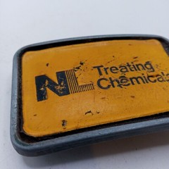 NL Treating Chemicals Belt Buckle Yellow Vintage Distressed Well Worn