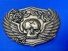 Dimensional Skull Head With Wings And Flowers – Raised Belt Buckle