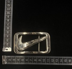 vintage Nike Y2K belt buckle features a polished metal construction RARE