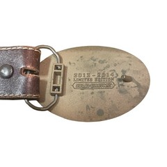 Justin tooled leather belt with bronze belt buckle limited edition western