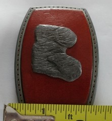 LONG HAIR DOG LHASA APSO ON A RED LEATHER PIECE SET ON A BELT BUCKLE