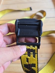 Off-White Industrial Belt in the yellow and black colorway, featuring a black…