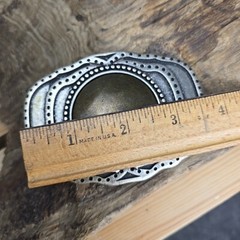 Unique vintage brass and steel belt buckle.
